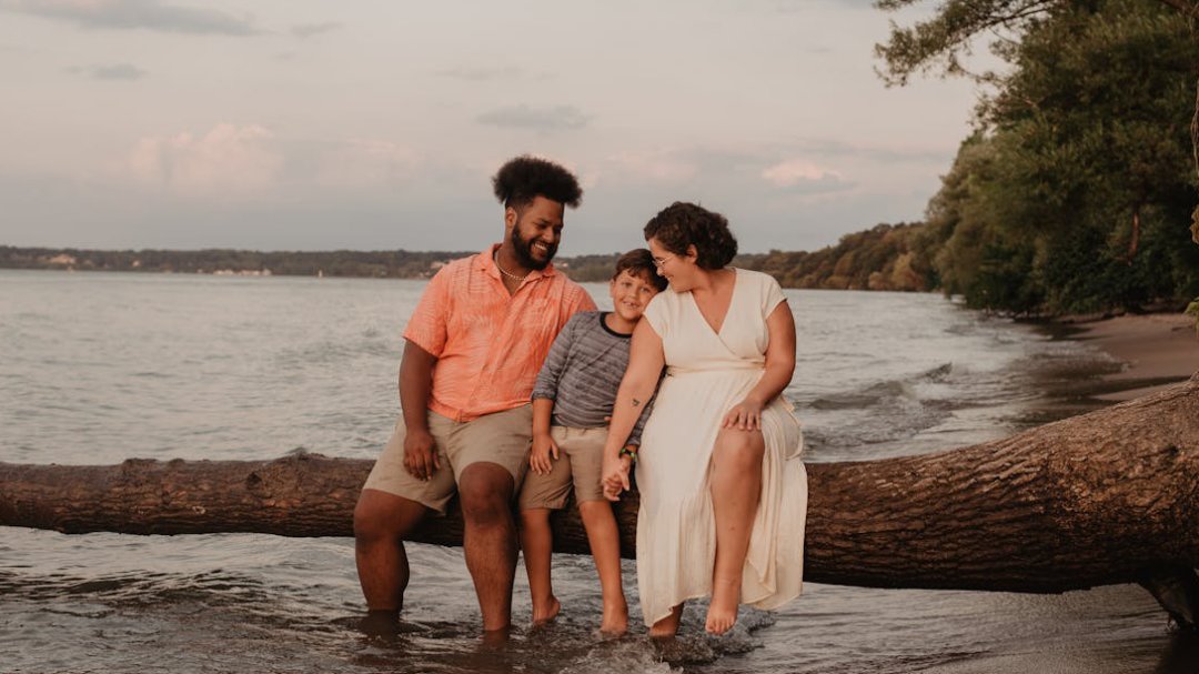 A family enjoying a sunny day by the lake